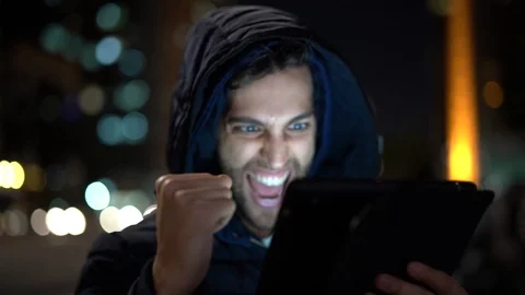 Guy Having Good News on tablet Stock Footage 89729732