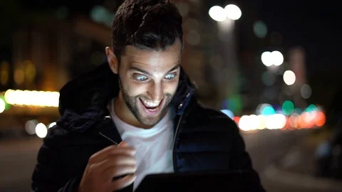 Guy Having Good News on tablet Stock Footage 89729849