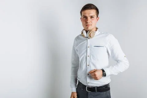 Guy with headphones. The guy in the Studio. The guy in the white shirt. Hands Stock Photos