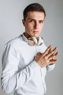 Guy with headphones. The guy in the Studio. The guy in the white shirt. Hands Stock Photos
