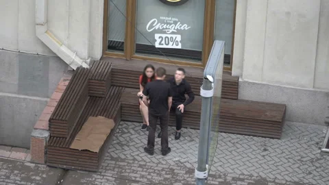 The guy held a knockout man in the street. Stock Footage 91198754