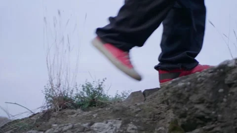 A guy is hiking in the mountains Stock Footage 254933125
