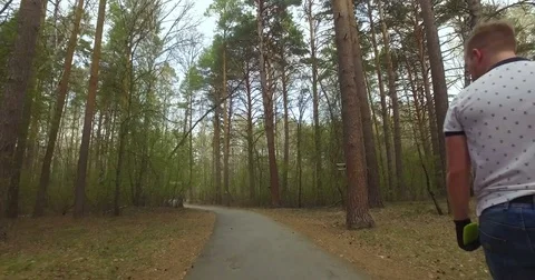 Guy on his longboard skate. Tracking shot Stock Footage 75335298
