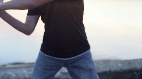 Guy hit a fruit bat slow motion. Man break vegetable piece. Baseball slowmotion. Stock Footage 72548387