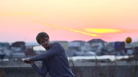 Guy hit a fruit bat slow motion. Man break vegetable piece. Baseball slowmotion. Stock Footage 72549061