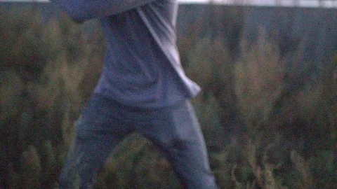 Guy hit a fruit bat slow motion. Man break vegetable piece. Baseball slowmotion. Stock Footage 72550137