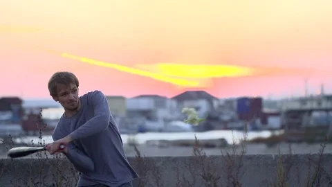 Guy hit a fruit bat slow motion. Man break vegetable piece. Baseball slowmotion. Stock Footage 72555521