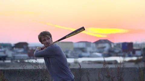 Guy hit a fruit bat slow motion. Man break vegetable piece. Baseball slowmotion. Stock Footage 72556824