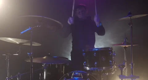 The guy hits the drums hard Stock Footage 153918515