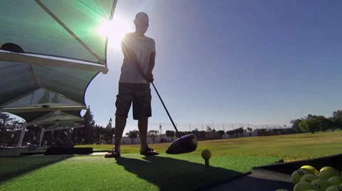 Guy hits golf ball 2 스톡 동영상 35523362