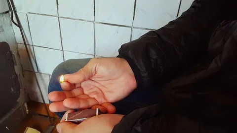 Guy holding a match in his hand Video stock 80408784