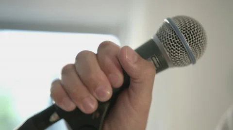 Guy holding microphone Stock-Footage 68651493