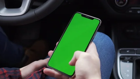 The guy holding phone with green screen and watching stories on instagram Stock Footage 116764346