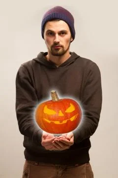 The guy is holding a pumpkin Stock Photos