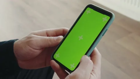 Guy holding a smartphone. Mock-up 스톡 동영상 173692244