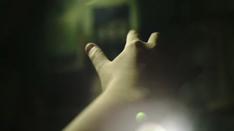 Guy holds out his hand to electric knife switches - 4K 4 Stock Footage 269689341