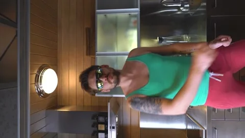 A guy at home on self-isolation fooling around on camera Stock Footage 136430097