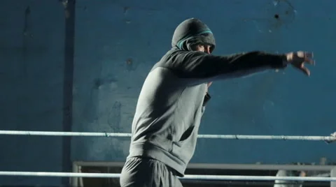 Guy in the hood catches and throws a hard ball Stock Footage 51659635