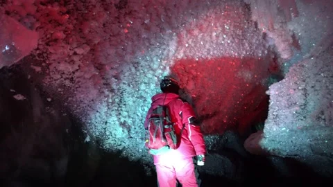 A guy in an ice cave with a lantern light. Stock Footage 150272510