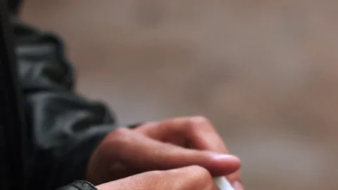 Guy ignites a cigarette Stock Footage 80432002
