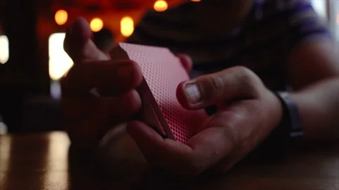 Guy interferes with cards. slow motion. Video stock 137301115