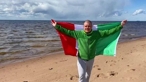 A guy with an Italian flag behind Video stock 130435813