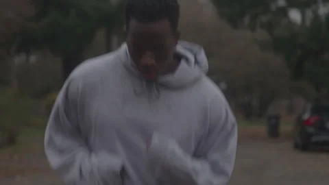 Guy Jogs In Sweat Suit Outside Stock Footage 270324897