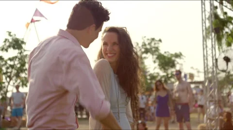 Guy jokes while dancing, girl laughs Stock Footage 63077495