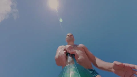 The guy is juggling a plastic bottle, training his dexterity and skill. Stock Footage 339931867
