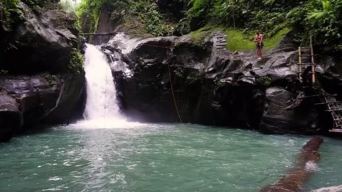 Guy jumped into a waterfall Video stock 122965681