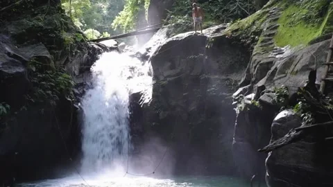 Guy jumped into a waterfall Video stock 138001354