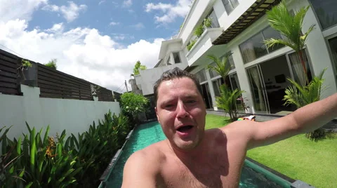 Guy jumping into the pool, underwater shot Stock Footage 50863539