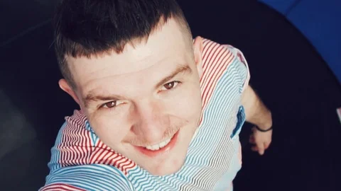 The guy is jumping on a trampoline. He is happy. Fun. Video stock 89841832