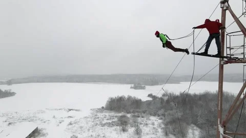 A guy jumps from a height on an insurance Stock Footage 181936606