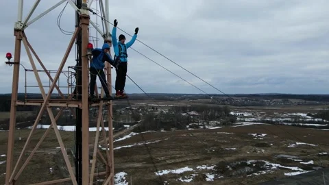 A guy jumps from a tower, a man falls from a height, rope jumping Stock Footage 172229805