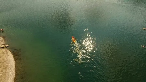 A guy kayaking at the Lake Stock-Footage 104801858