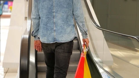 Guy keeps packages with purchases. Shopping. Video stock 95486461