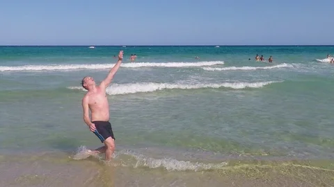 Guy kicking ball with bicycle kick at beach in slow motion 動画素材 88601422