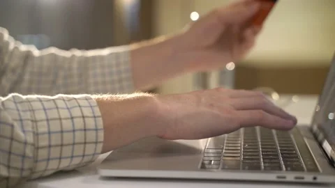 A guy with a laptop makes a card purchase Stock Footage 131511518