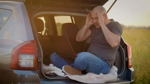 Guy with laptop types on computer and commits irreparable mistake in commercial Stock Footage 248974363