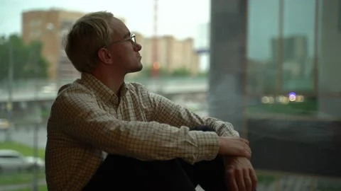 Guy with a laptop by the window Stock Footage 131511392