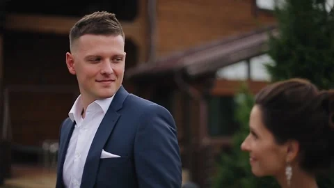 The guy leads his girlfriend through the park by the hand Stock Footage 148828748