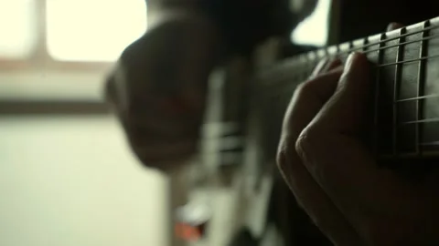 Guy learning to guitar at home Stock Footage 133906965