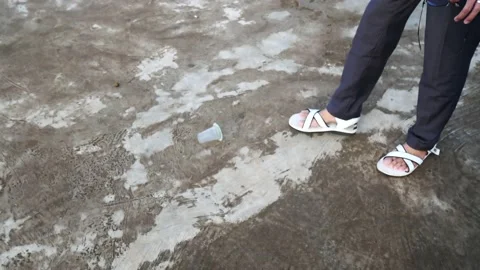 Guy legs playfully kick leaved trash energy drink can on a street. Stock-Footage 206326588