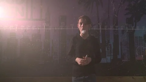 Guy let ring. Boy make vape tricks Stock Footage 72028664