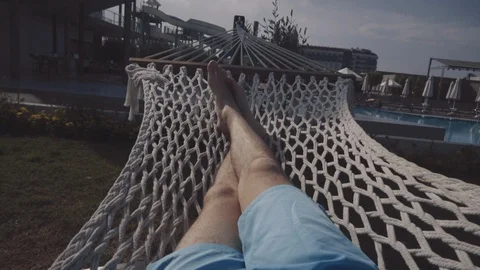 The guy lies in a hammock Stock Footage 90590428