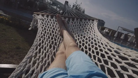 The guy lies in a hammock Stock Footage 90590553