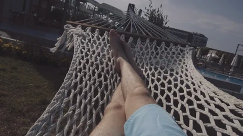 The guy lies in a hammock Stock Footage 90590795