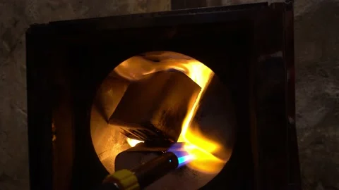 The guy lights a fire in the oven. Put the drava. Stock Footage 232720020