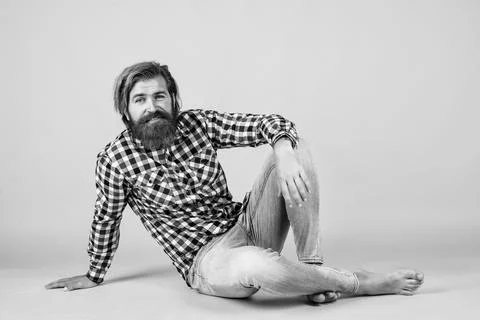Guy with long lush beard and mustache on face. handsome confident man has Stock Photos